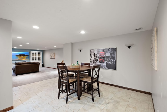 4407 Curve Ave, Edina, MN 55424 - dining room with recessed lighting, light tile patterned floors, and light colored carpet