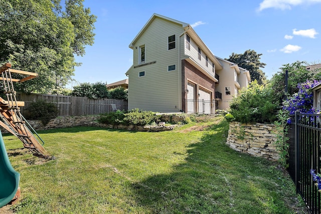 4407 Curve Ave, Edina, MN 55424 - fenced backyard with a playground and a garage