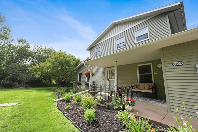 5100 16th St NE, Minden Twp, MN 56379 - view of front of house with a front yard and a porch