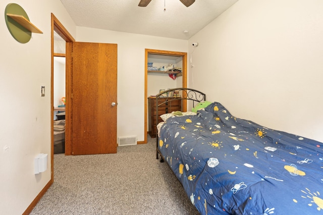 5100 16th St NE, Minden Twp, MN 56379 - bedroom with carpet floors, a textured ceiling, and ceiling fan