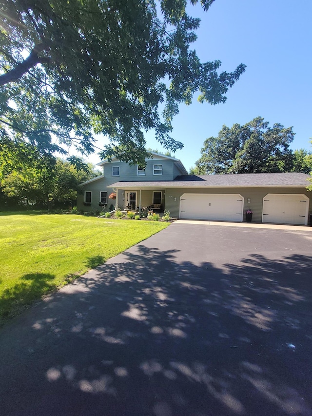 5100 16th St NE, Minden Twp, MN 56379 - view of front of house featuring a front yard, driveway, and a garage