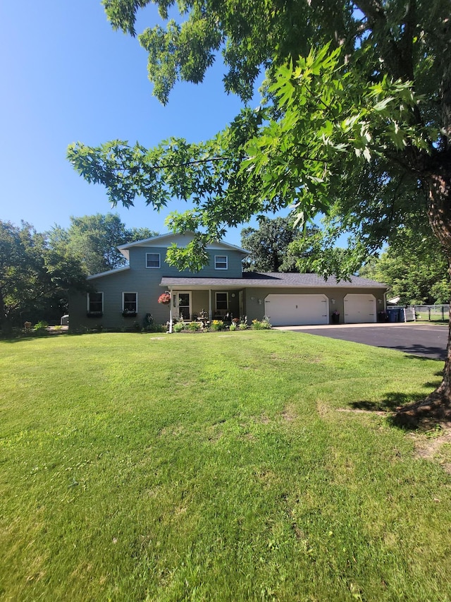 5100 16th St NE, Minden Twp, MN 56379 - view of front facade featuring an attached garage, asphalt driveway, and a front yard