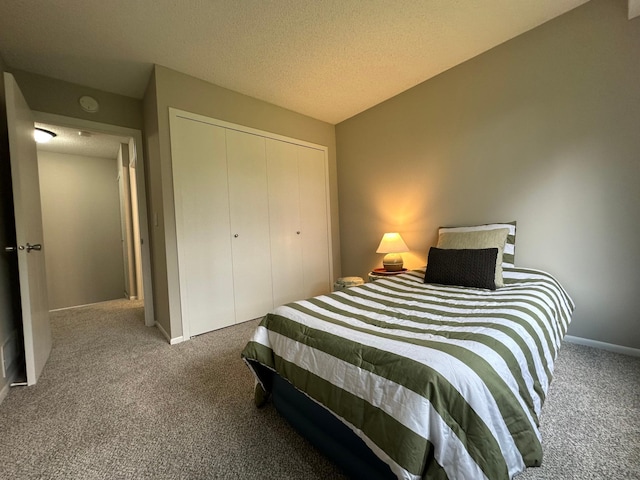 12619 Alder St NW, Coon Rapids, MN 55448 - carpeted bedroom featuring a closet and a textured ceiling