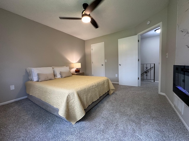 12619 Alder St NW, Coon Rapids, MN 55448 - bedroom with carpet floors, a ceiling fan, and a textured ceiling
