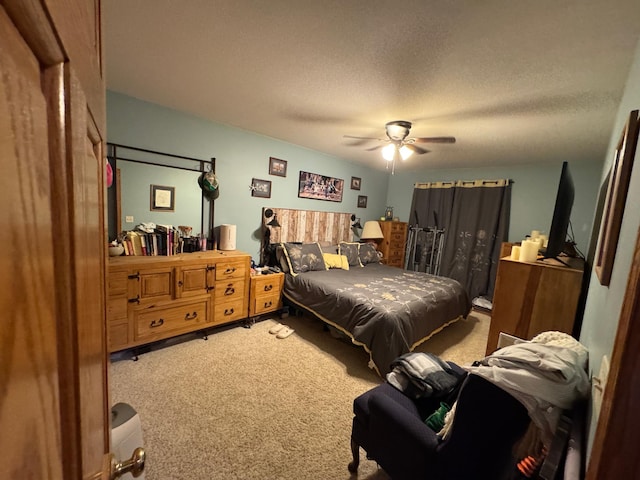 1420 4th St SW, Wadena, MN 56482 - carpeted bedroom with a textured ceiling and ceiling fan