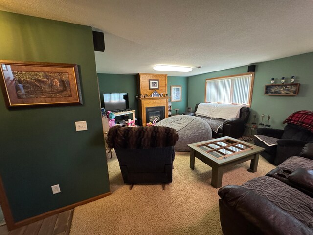 1420 4th St SW, Wadena, MN 56482 - living area with a fireplace, light carpet, and a textured ceiling