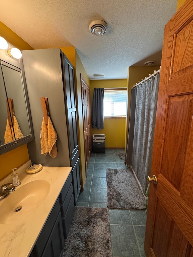 1420 4th St SW, Wadena, MN 56482 - bathroom featuring vanity, a textured ceiling, and a shower with curtain