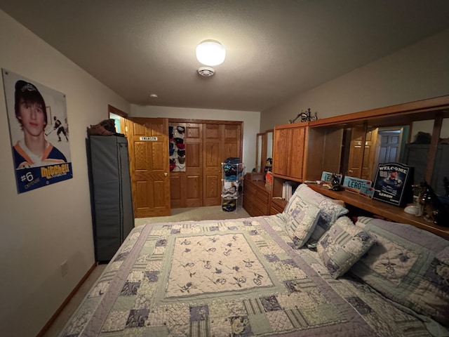 1420 4th St SW, Wadena, MN 56482 - bedroom featuring fridge, light colored carpet, and a closet
