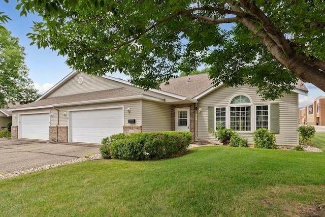114 Oxford Path, Mankato, MN 56001 - ranch-style home with an attached garage, driveway, a front yard, brick siding, and roof with shingles