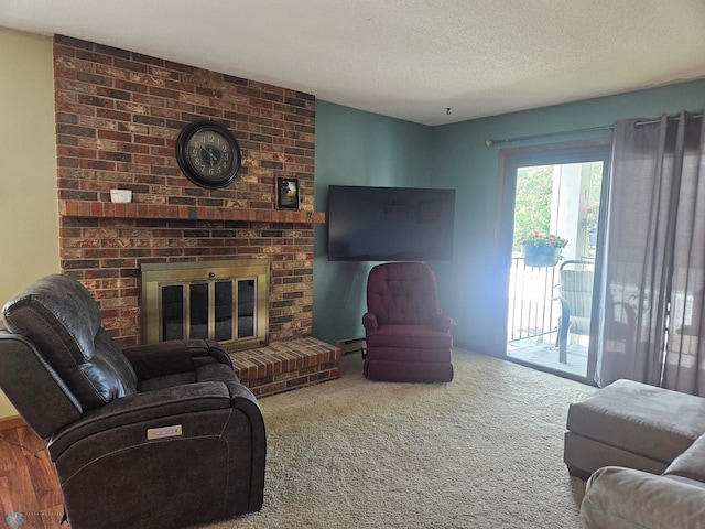 311 Prairiewood Cir S Unit 307, Fargo, ND 58103 - living area with a textured ceiling, a fireplace, and carpet flooring