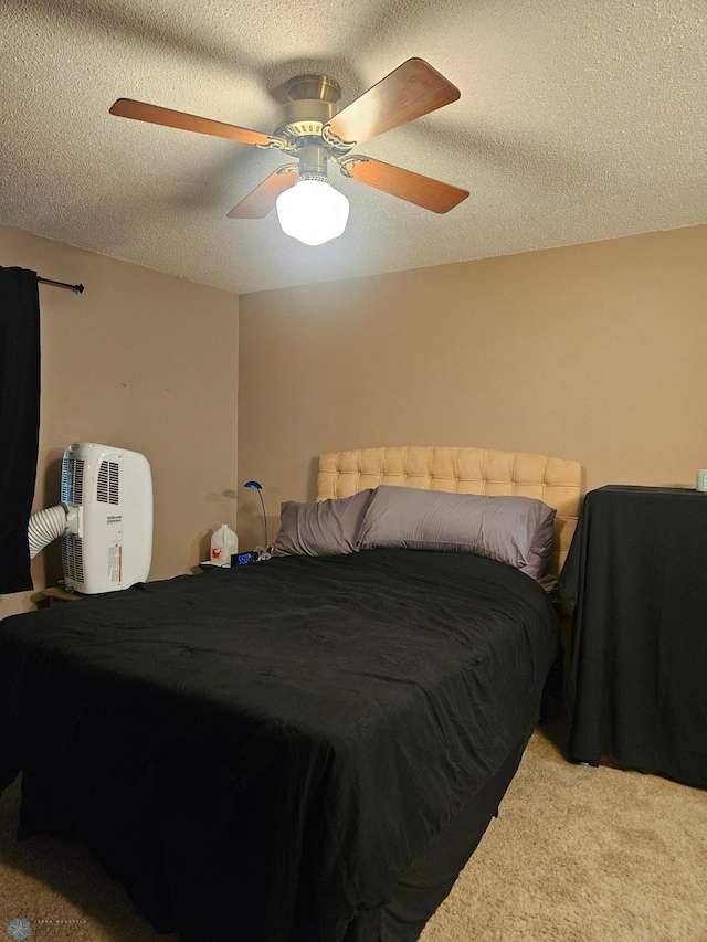 311 Prairiewood Cir S Unit 307, Fargo, ND 58103 - bedroom featuring carpet floors, a ceiling fan, and a textured ceiling