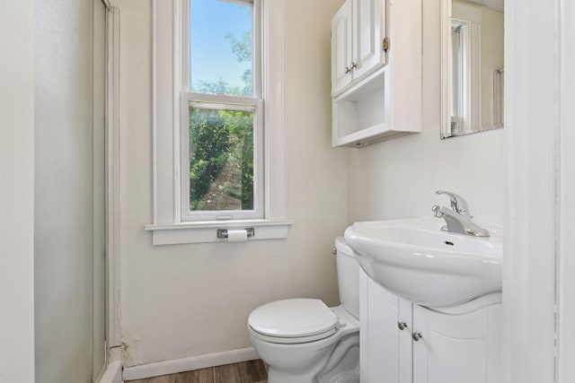 1108 16th Ave SE, Minneapolis, MN 55414 - full bathroom with vanity, a shower with shower door, and wood finished floors