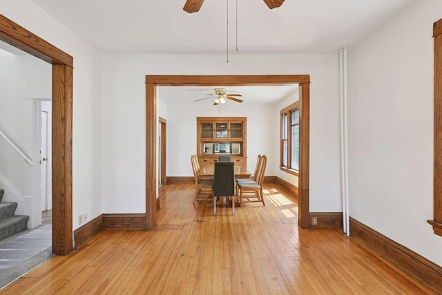 1108 16th Ave SE, Minneapolis, MN 55414 - dining space with a ceiling fan, light wood-style flooring, and stairway