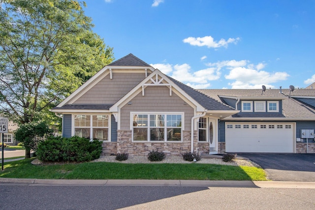 4715 Wyngate Blvd, Forest Lake, MN 55025 - craftsman inspired home featuring driveway, stone siding, and roof with shingles