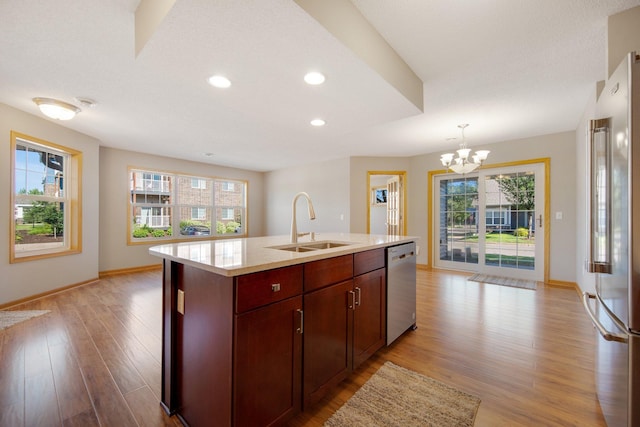 4715 Wyngate Blvd, Forest Lake, MN 55025 - kitchen featuring appliances with stainless steel finishes, a chandelier, light wood-style flooring, a center island with sink, and recessed lighting