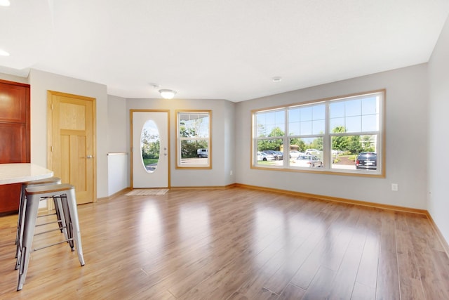 4715 Wyngate Blvd, Forest Lake, MN 55025 - unfurnished living room with light wood-type flooring and recessed lighting