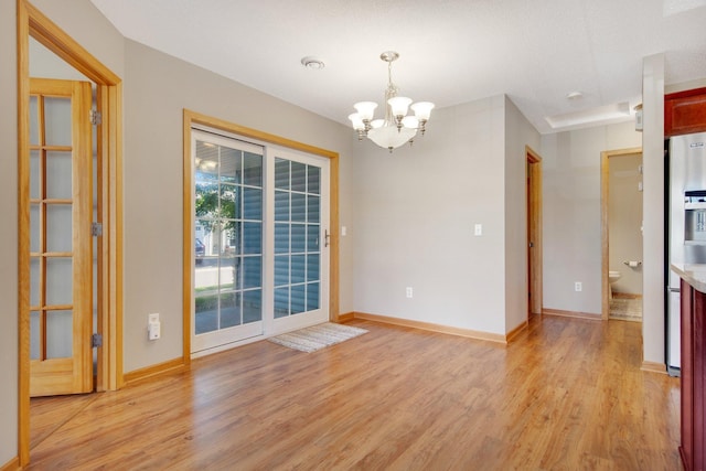 4715 Wyngate Blvd, Forest Lake, MN 55025 - spare room with light wood finished floors and a chandelier