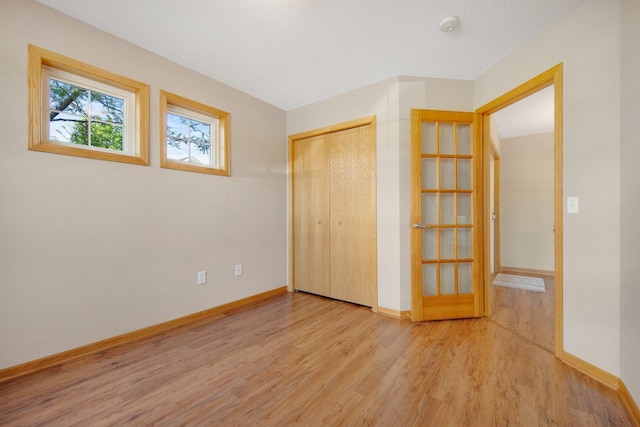 4715 Wyngate Blvd, Forest Lake, MN 55025 - unfurnished bedroom with wood finished floors and a closet