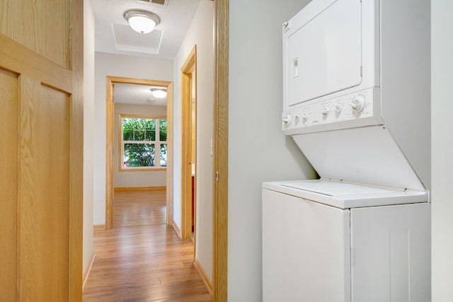 4715 Wyngate Blvd, Forest Lake, MN 55025 - laundry room featuring stacked washer / dryer and light wood-type flooring