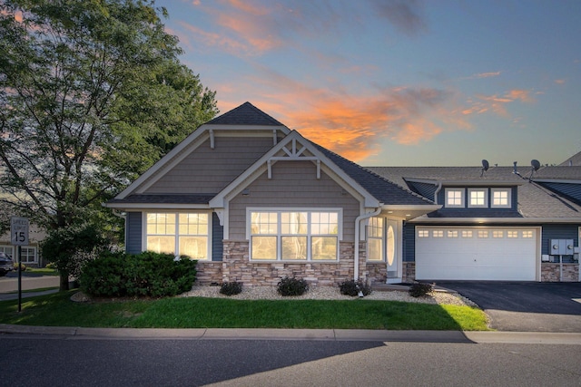 4715 Wyngate Blvd, Forest Lake, MN 55025 - view of front of property with driveway and stone siding