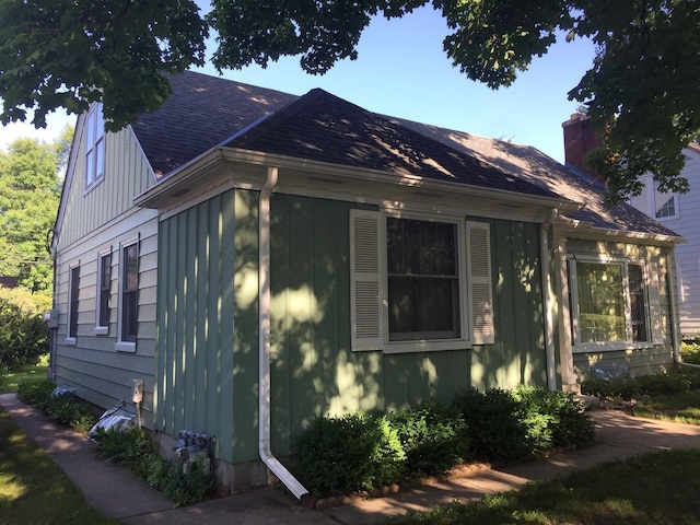 5505 Morgan Ave S, Minneapolis, MN 55419 - view of home's exterior with roof with shingles and a chimney