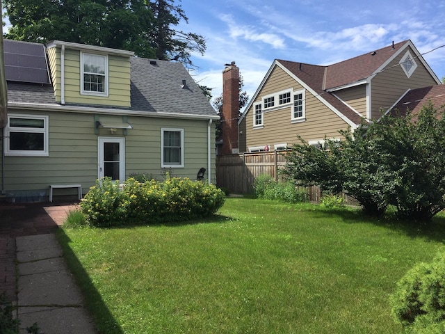5505 Morgan Ave S, Minneapolis, MN 55419 - back of house featuring a shingled roof and a chimney