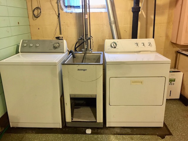 5505 Morgan Ave S, Minneapolis, MN 55419 - washroom featuring independent washer and dryer and concrete block wall