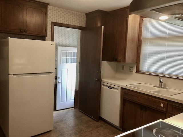 5505 Morgan Ave S, Minneapolis, MN 55419 - kitchen featuring white appliances, light countertops, and wall chimney range hood