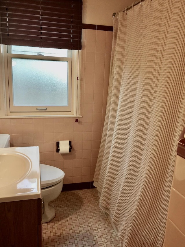 5505 Morgan Ave S, Minneapolis, MN 55419 - full bathroom featuring tile walls, vanity, a shower with shower curtain, and tile patterned flooring