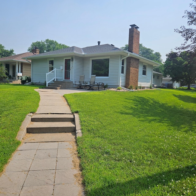 4700 Xerxes Ave N, Minneapolis, MN 55430 - view of front of property featuring a chimney and a front yard