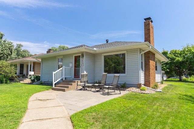 4700 Xerxes Ave N, Minneapolis, MN 55430 - view of front of house featuring a chimney, a patio area, and a front yard
