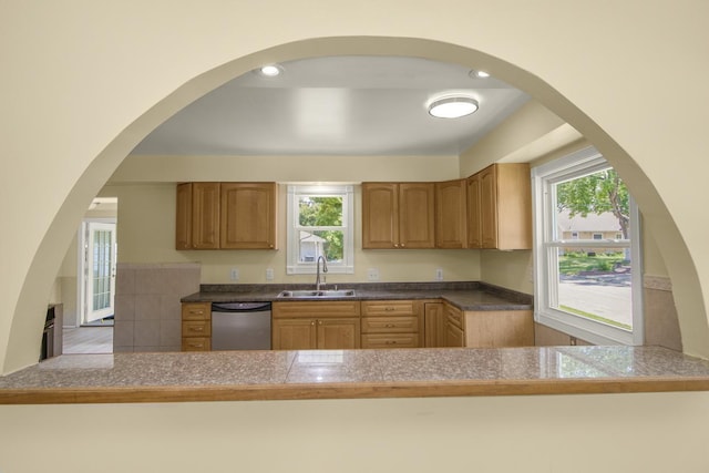 4700 Xerxes Ave N, Minneapolis, MN 55430 - kitchen with stainless steel dishwasher, tile counters, and a peninsula