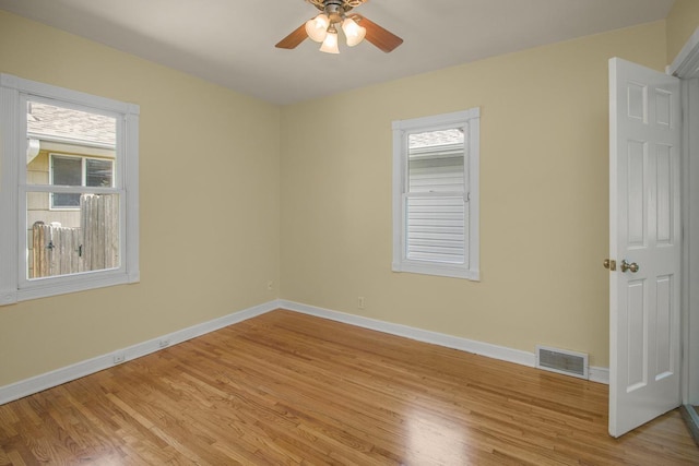 4700 Xerxes Ave N, Minneapolis, MN 55430 - empty room featuring light wood-style flooring, healthy amount of natural light, and ceiling fan