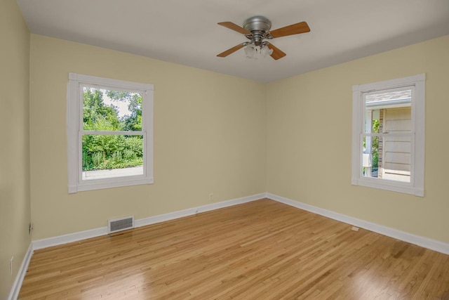 4700 Xerxes Ave N, Minneapolis, MN 55430 - spare room featuring plenty of natural light, light wood finished floors, and a ceiling fan