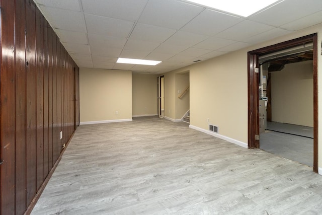4700 Xerxes Ave N, Minneapolis, MN 55430 - finished below grade area with light wood-type flooring, stairway, wood walls, and a drop ceiling