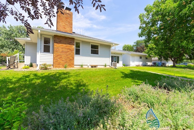 4700 Xerxes Ave N, Minneapolis, MN 55430 - back of property with a chimney and a lawn