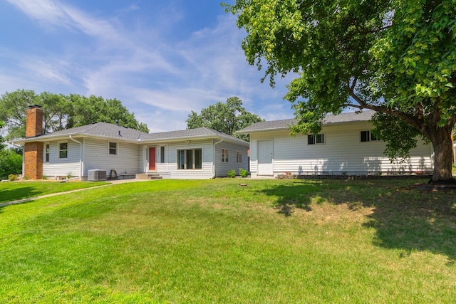 4700 Xerxes Ave N, Minneapolis, MN 55430 - rear view of house featuring a chimney, entry steps, a lawn, and a patio area