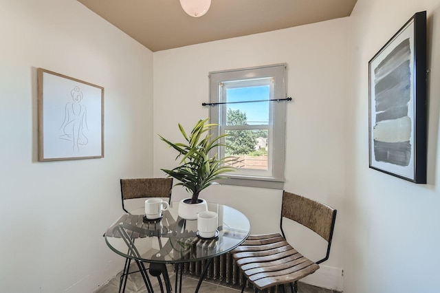 2810 Morgan Ave N, Minneapolis, MN 55411 - tiled dining room featuring baseboards
