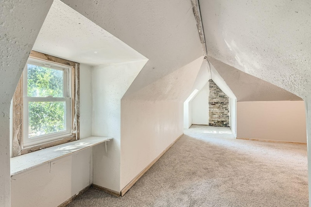 2810 Morgan Ave N, Minneapolis, MN 55411 - bonus room featuring vaulted ceiling, carpet, and a textured ceiling
