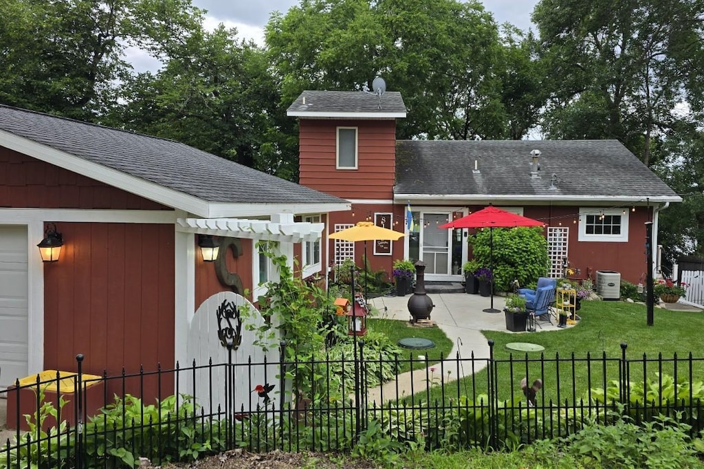8139 Griffith Ave NW, Corinna Twp, MN 55358 - rear view of house with a patio and a shingled roof