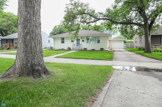 414 21st Ave N, Fargo, ND 58102 - single story home with driveway, a front yard, stucco siding, a garage, and an outbuilding