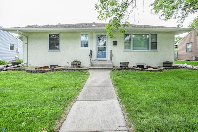 414 21st Ave N, Fargo, ND 58102 - view of front of house with stucco siding and a front yard