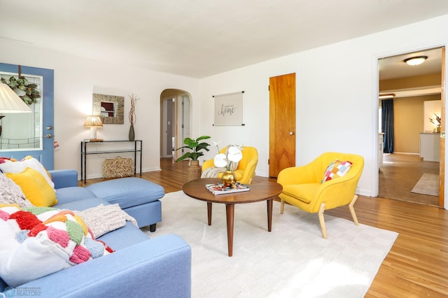 414 21st Ave N, Fargo, ND 58102 - living room with arched walkways and light wood-style flooring