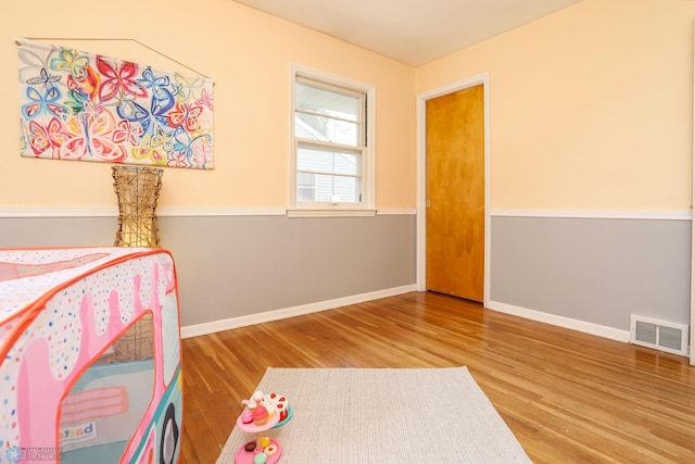 414 21st Ave N, Fargo, ND 58102 - bedroom featuring wood finished floors and baseboards