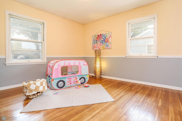 414 21st Ave N, Fargo, ND 58102 - recreation room with wood-type flooring and baseboards