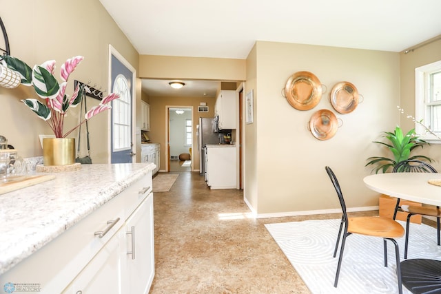 414 21st Ave N, Fargo, ND 58102 - kitchen with white cabinets and freestanding refrigerator
