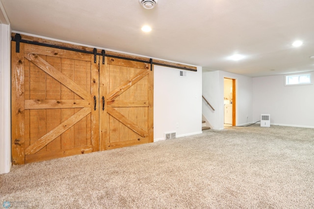 414 21st Ave N, Fargo, ND 58102 - basement with carpet, washer / dryer, stairway, recessed lighting, and a barn door