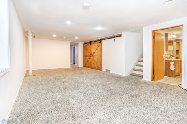 414 21st Ave N, Fargo, ND 58102 - carpeted empty room featuring a barn door, stairs, and recessed lighting