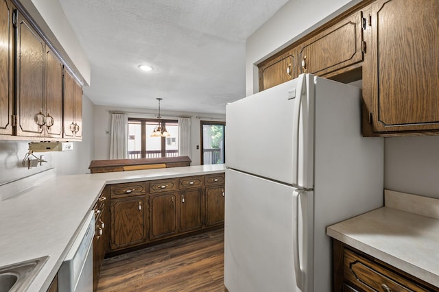 2671 Sumac Rdg, White Bear Lake, MN 55110 - kitchen with white appliances, dark wood-style floors, light countertops, recessed lighting, and a chandelier