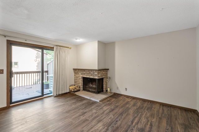 2671 Sumac Rdg, White Bear Lake, MN 55110 - unfurnished living room featuring wood finished floors, a fireplace, and a textured ceiling